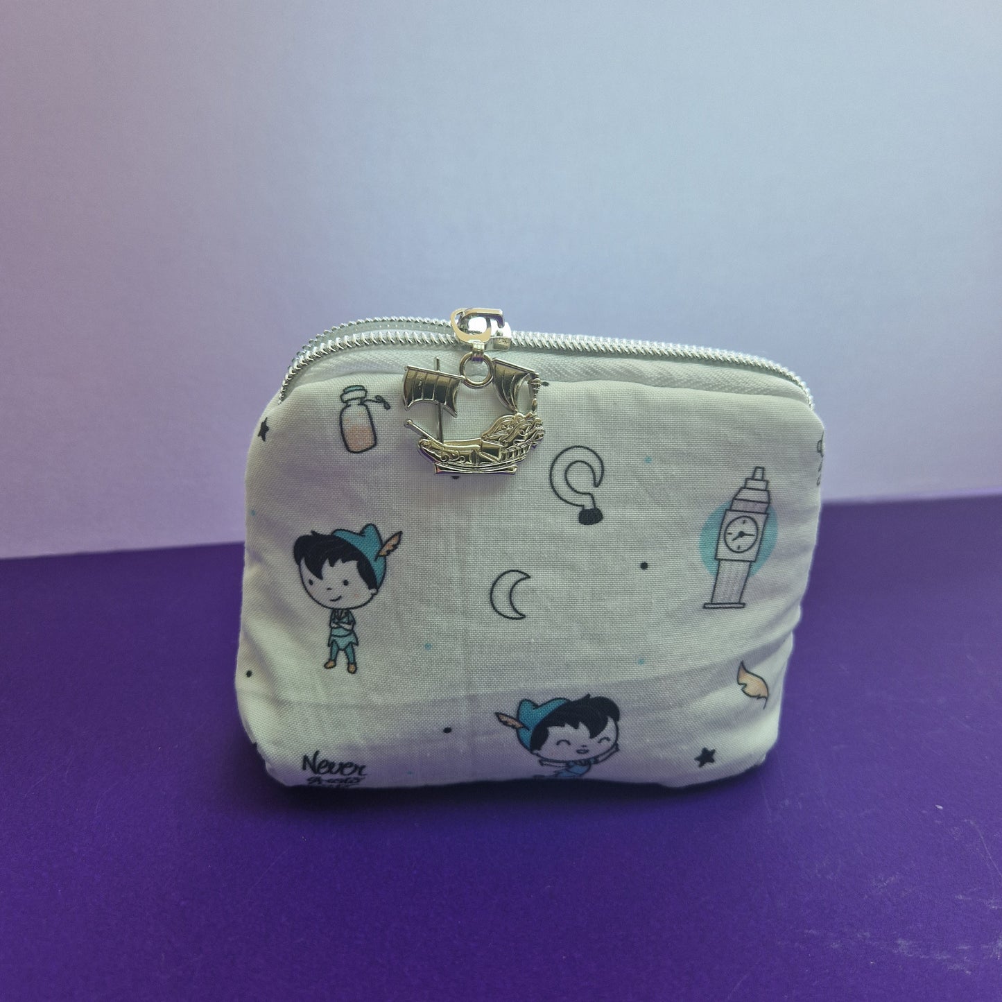Lost Boy lined mini triangle shaped pouch cosmetic bag with pirate ship zipper pull