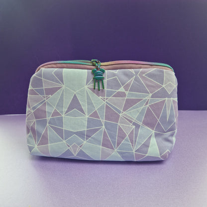 Purple Wall lined triangle cosmetic bag with water tower zipper pull
