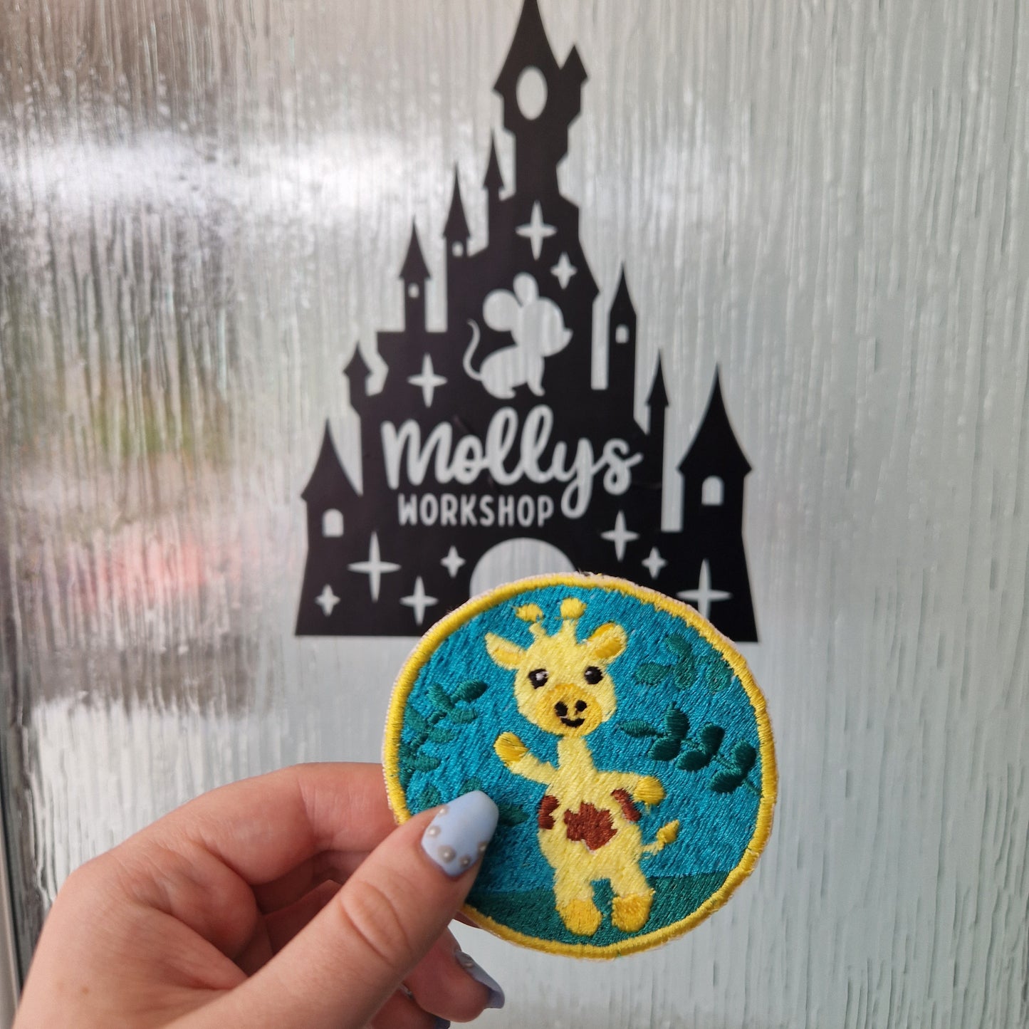 Floral giraffe iron-on embroidered patch