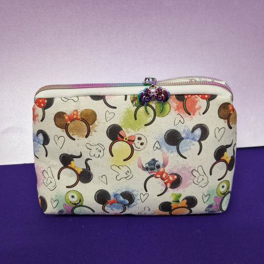 Mouse Ears lined triangle cosmetic bag with rainbow mouse ears zipper pull