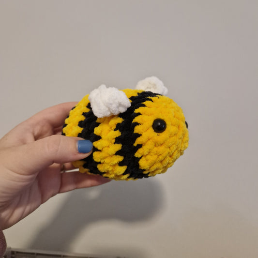 Bright yellow chenille crochet bumble bee