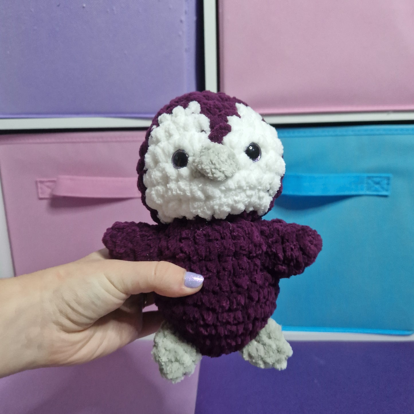 Purple and white crochet penguin