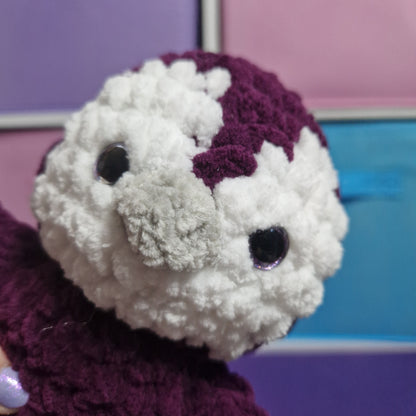 Purple and white crochet penguin