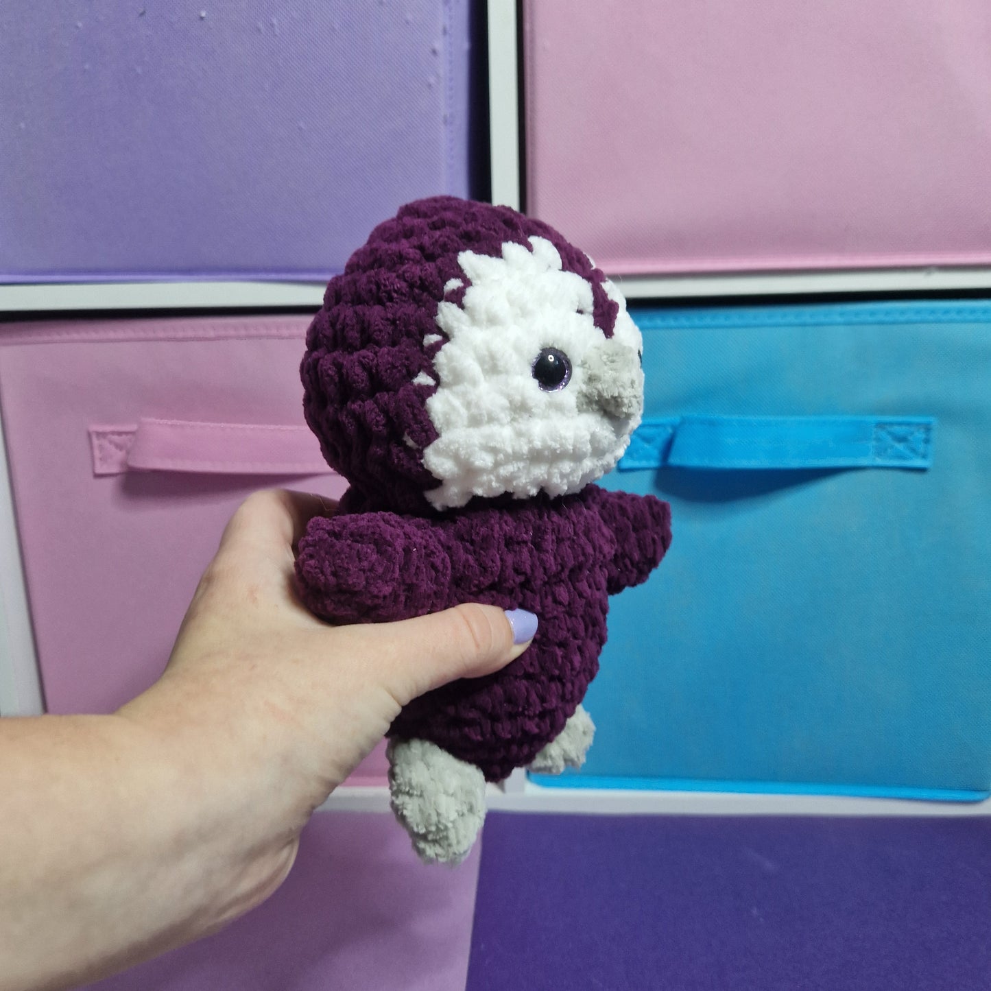 Purple and white crochet penguin