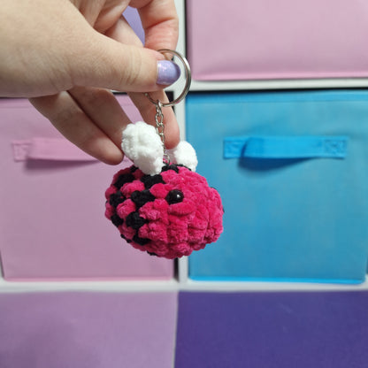 Bright pink bumble bee chenille yarn crochet keyring