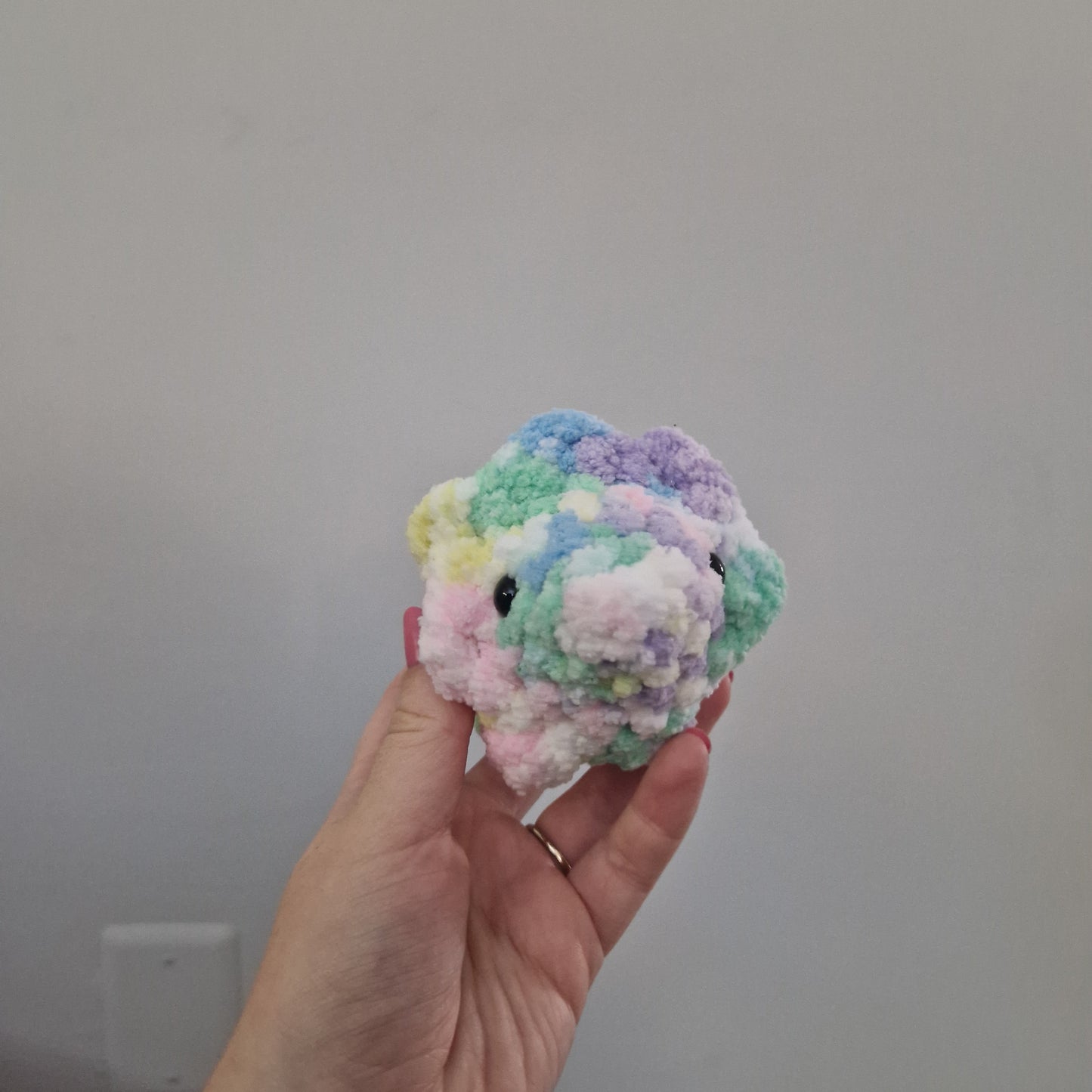Pastel rainbow triceratops crochet plushie