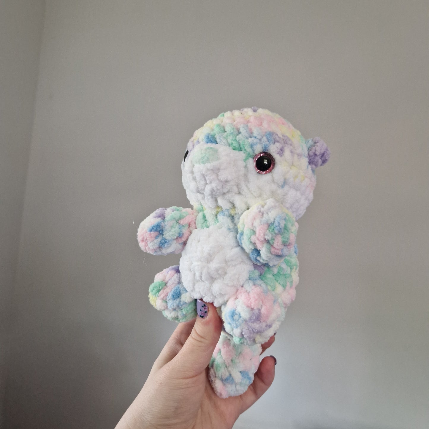 Pastel rainbow otter crochet plushie
