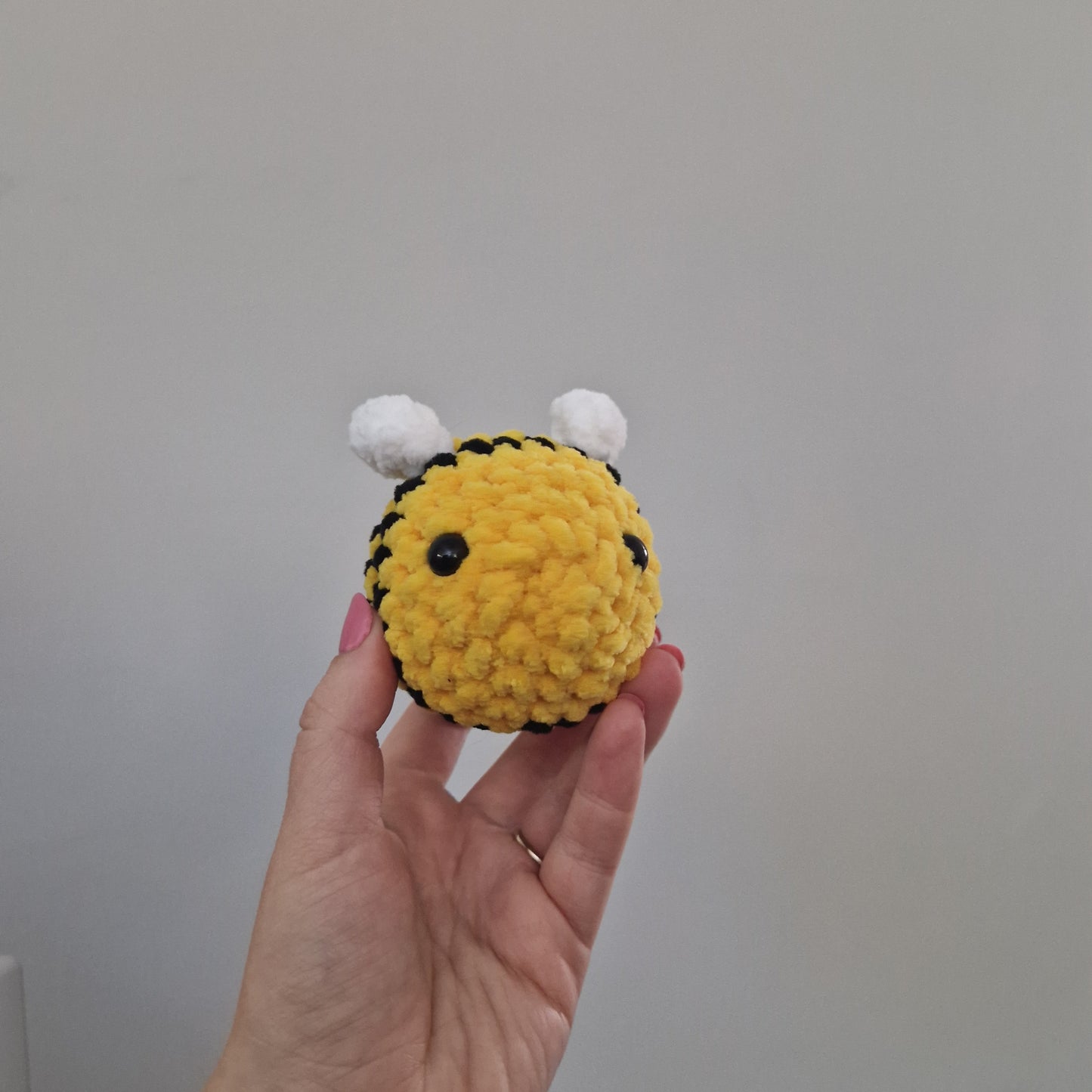 Bright yellow bumble bee crochet plushie