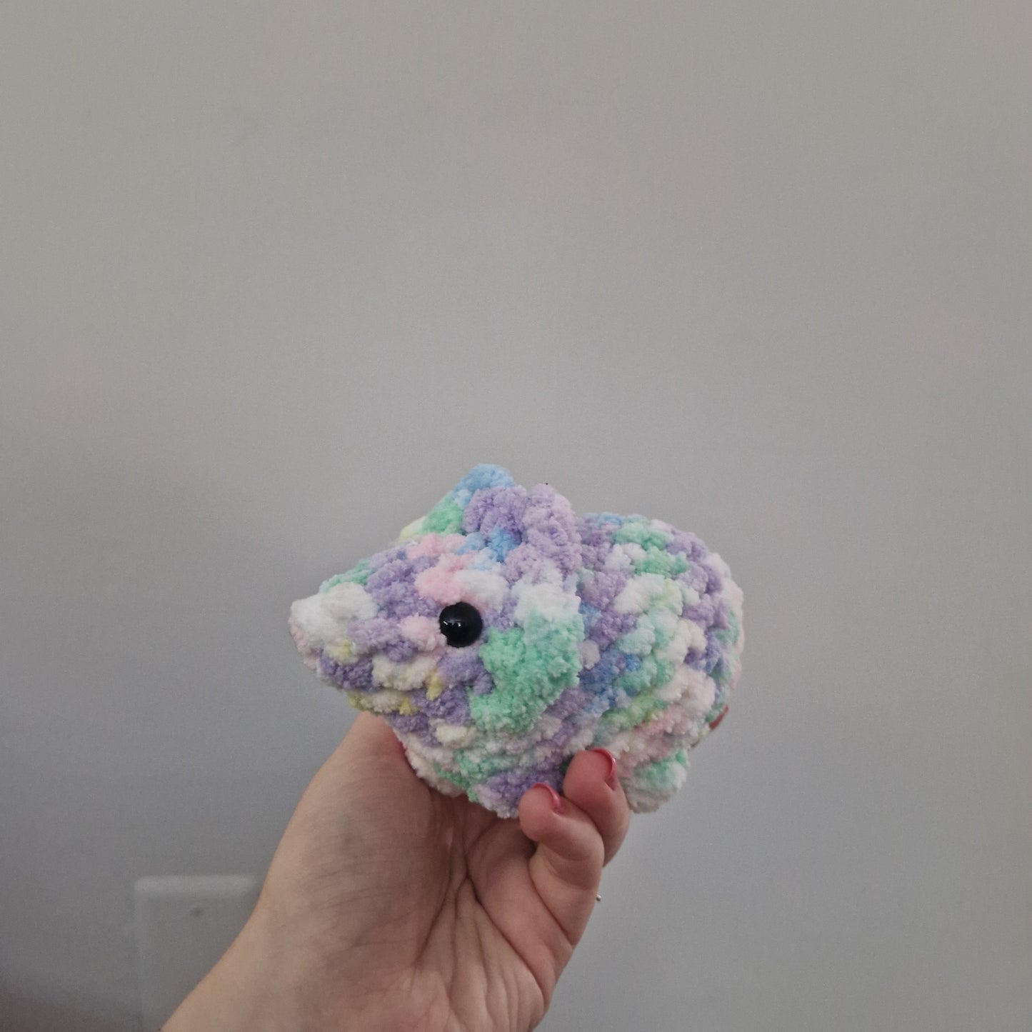 Pastel rainbow triceratops crochet plushie