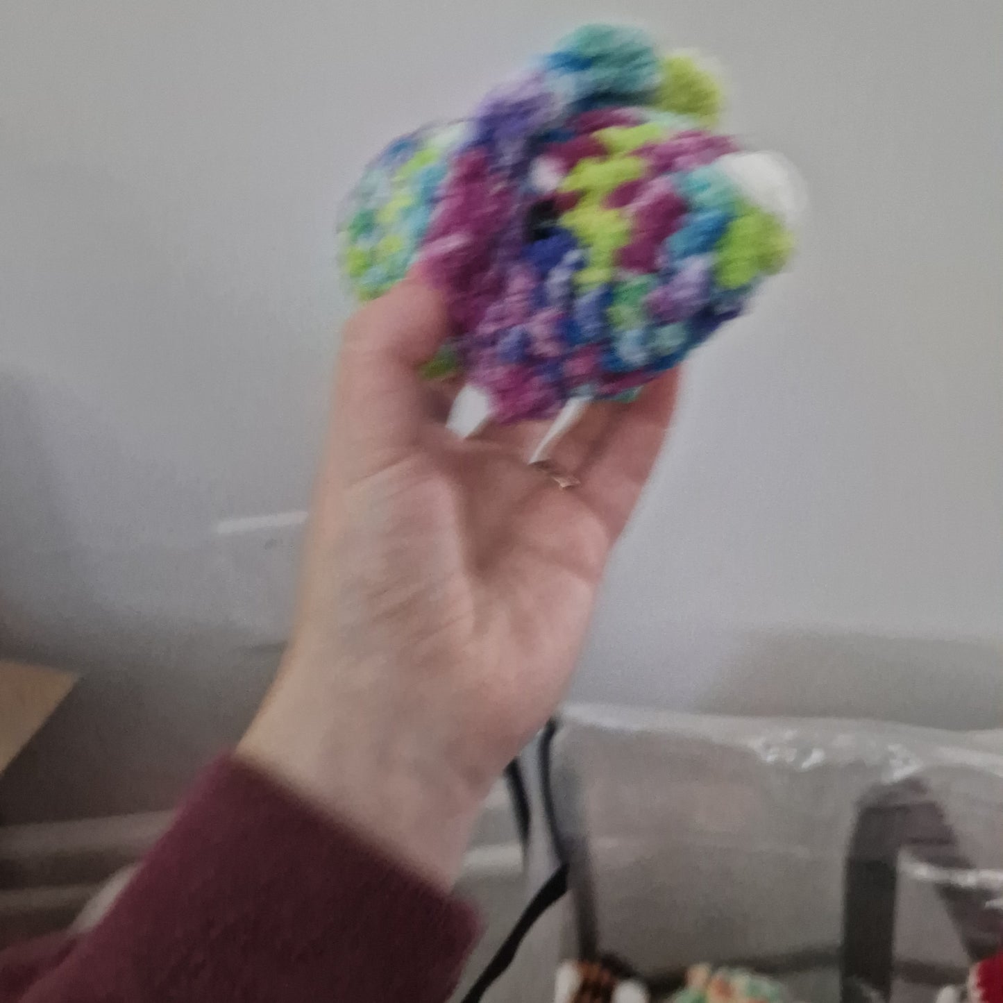 Green and pink triceratops crochet plushie