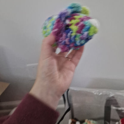 Green and pink triceratops crochet plushie