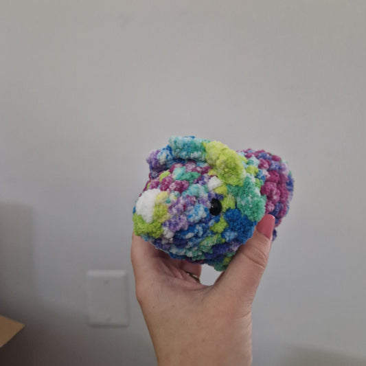 Green and pink triceratops crochet plushie