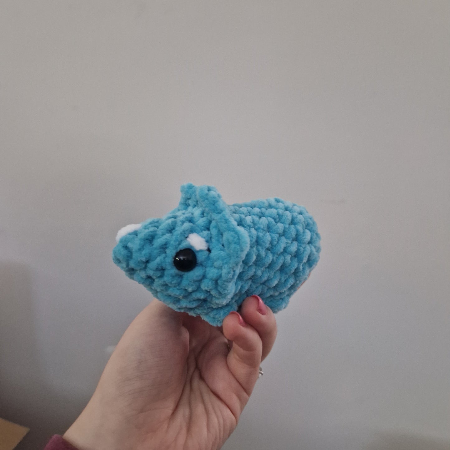 Blue triceratops crochet plushie