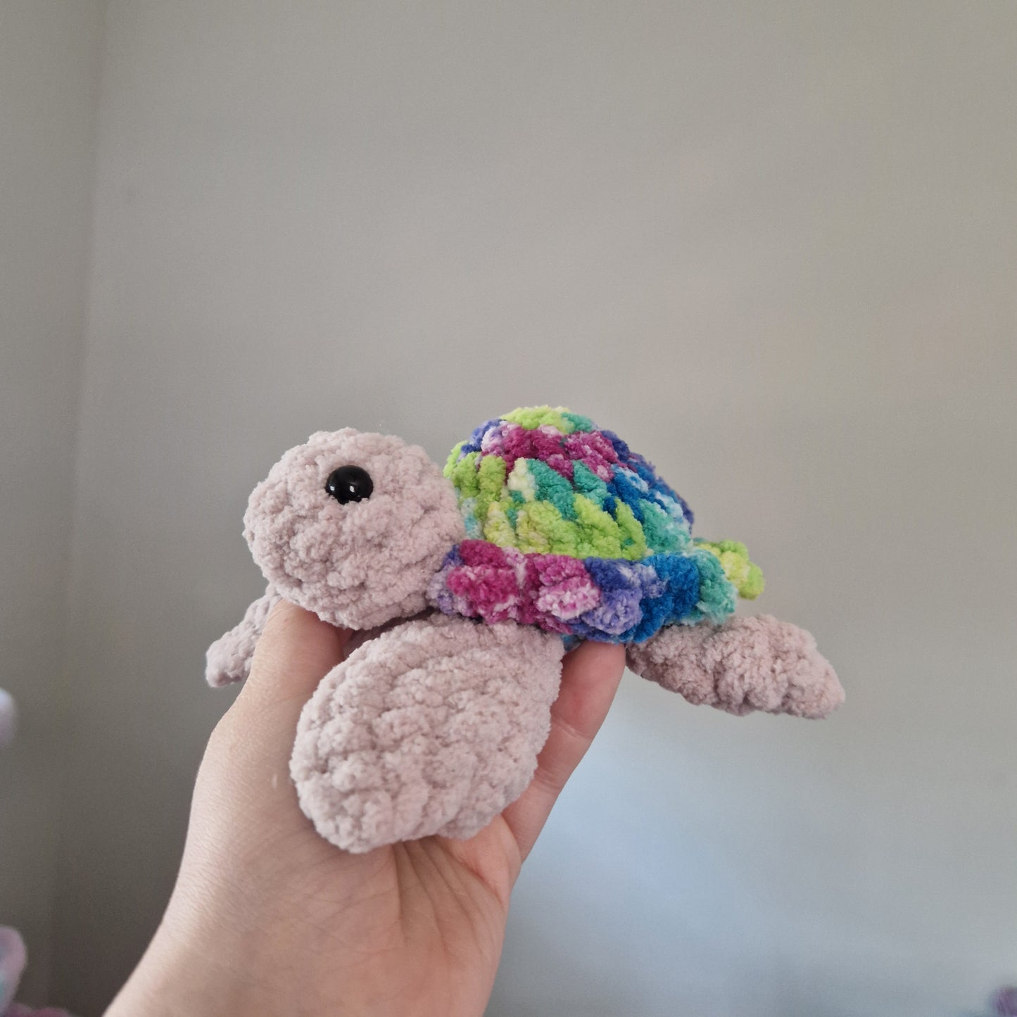 Green, pink, blue variegated sea turtle small crochet plushie