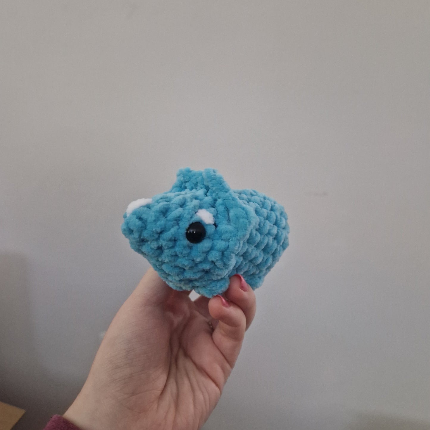 Blue triceratops crochet plushie