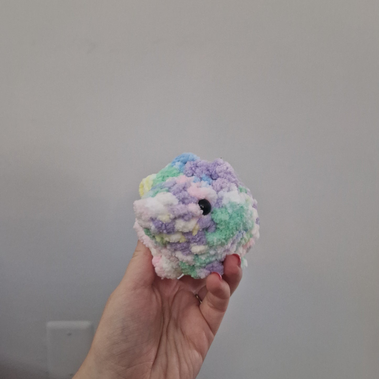 Pastel rainbow triceratops crochet plushie