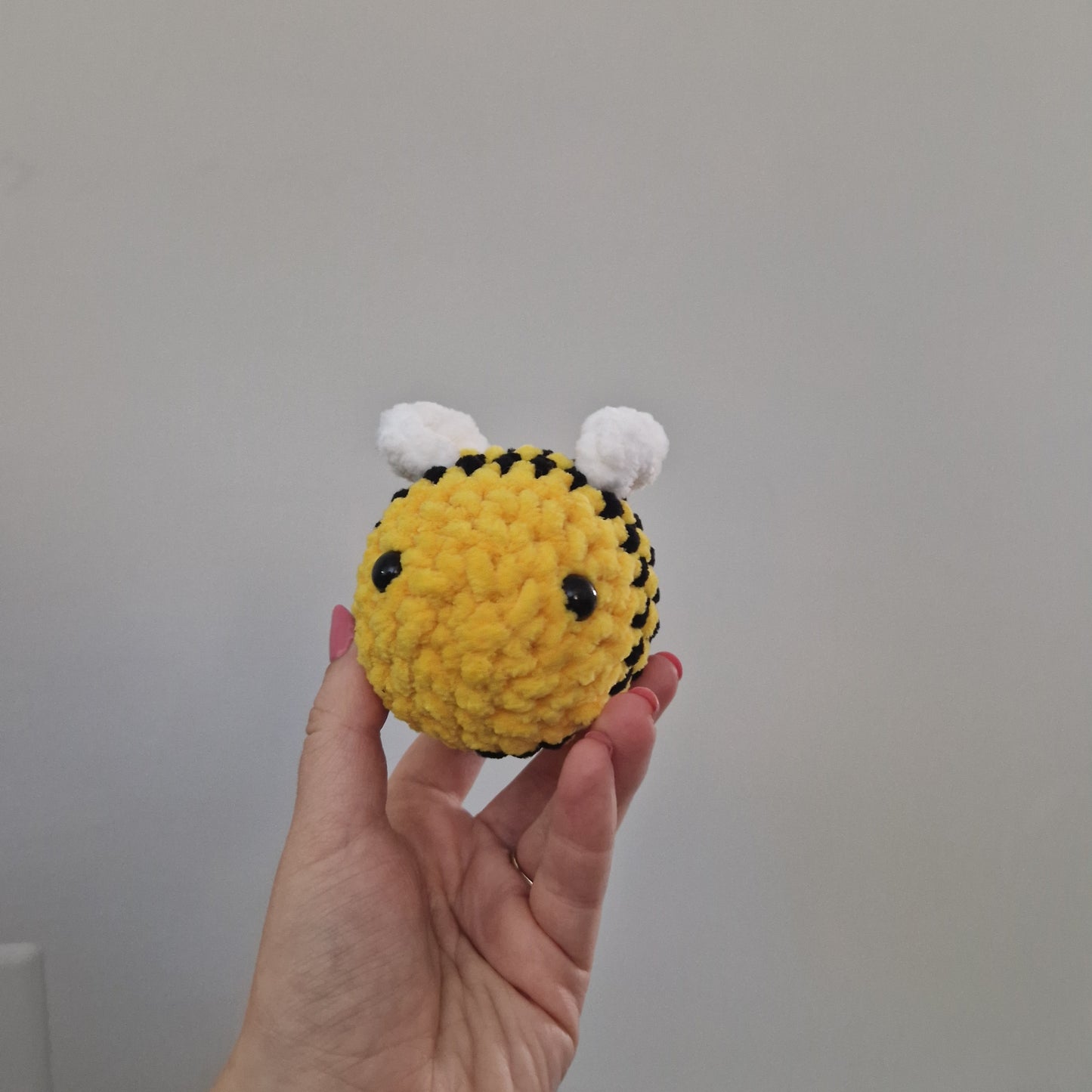 Bright yellow bumble bee crochet plushie