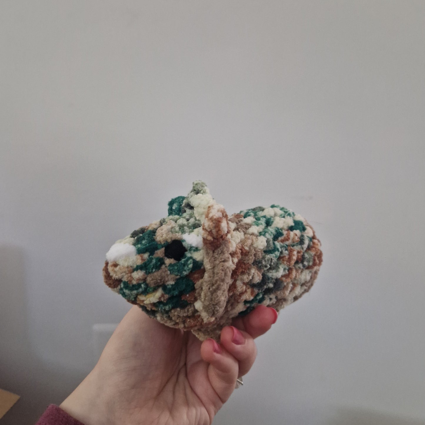 Brown and green triceratops crochet plushie