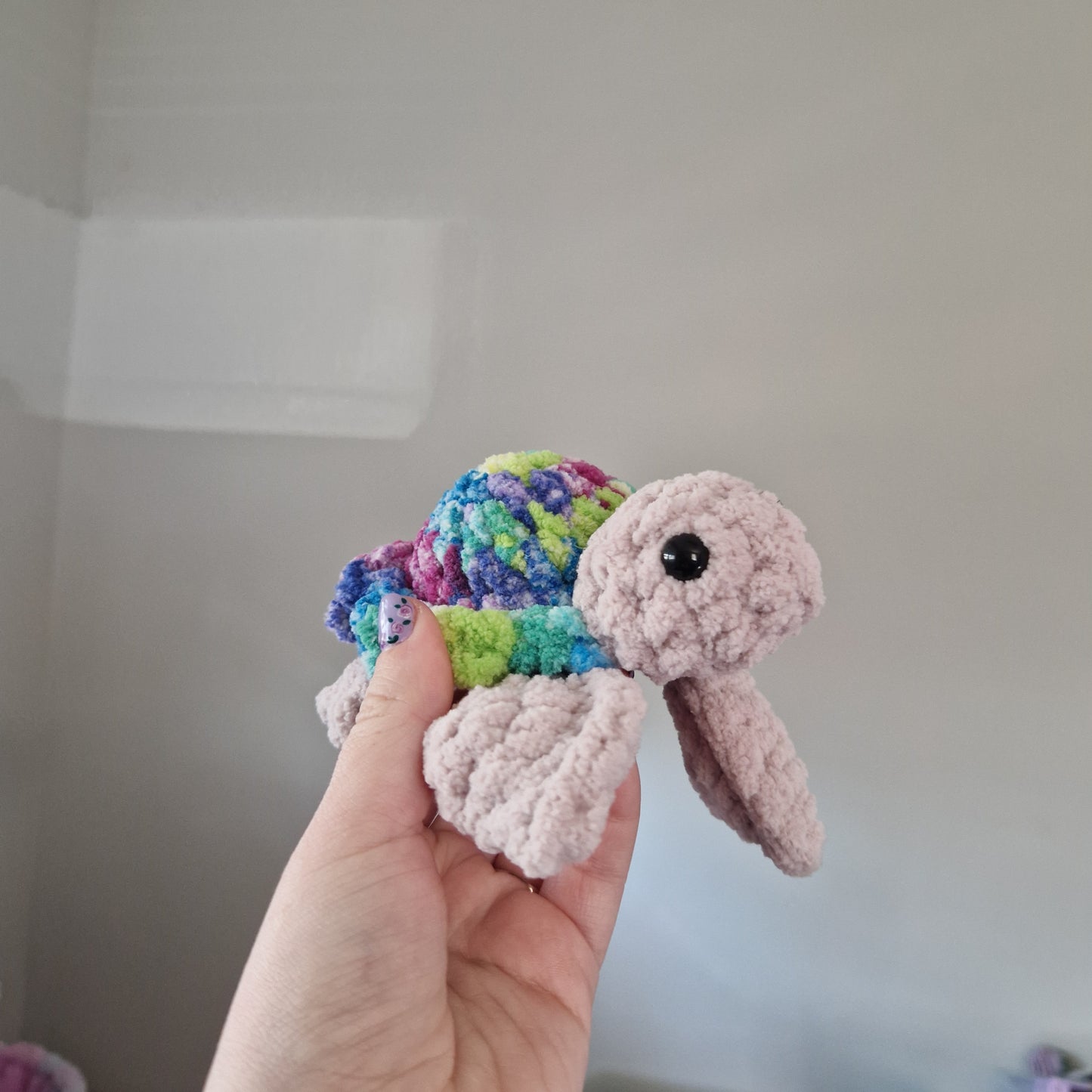 Green, pink, blue variegated sea turtle small crochet plushie