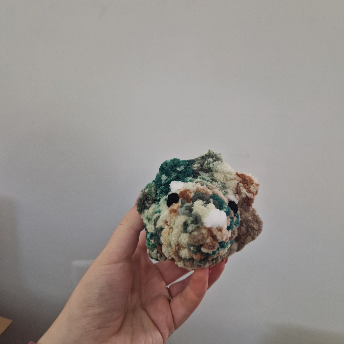 Brown and green triceratops crochet plushie