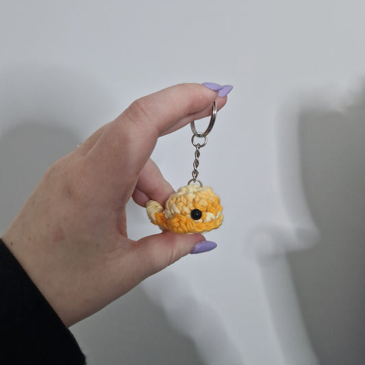 Orange and yellow multicoloured mini whale acrylic yarn crochet keyring