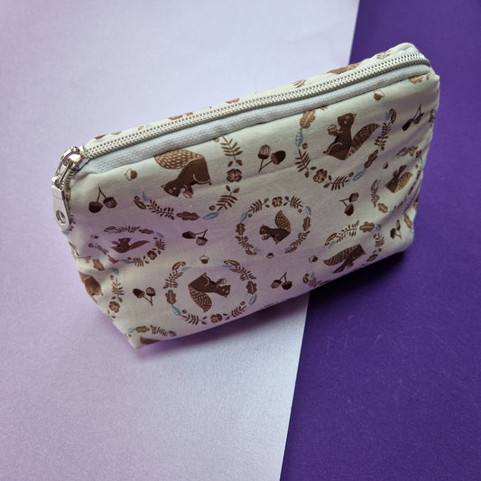 Squirrel lined triangle cosmetic bag with zipper