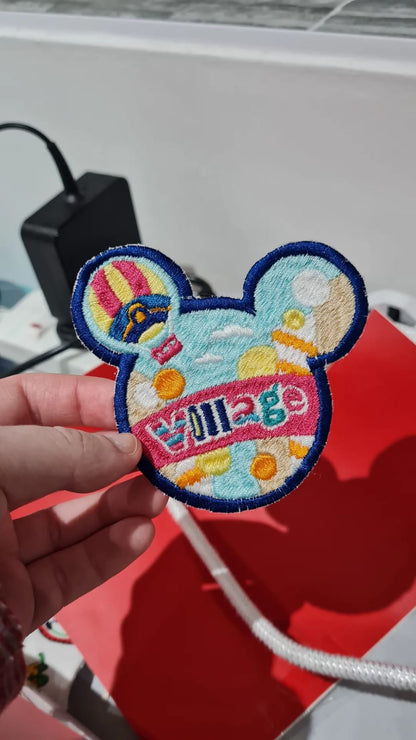 The Village iron-on embroidered patch